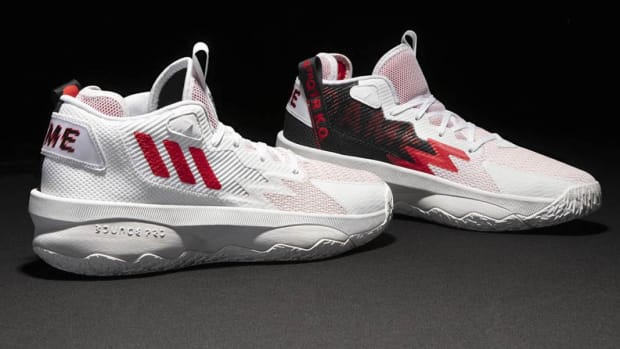 White, red, black Adidas Dame shoes.